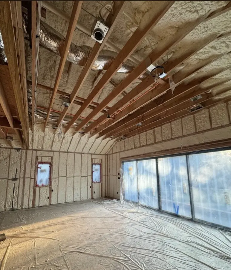 Interior walls and ceiling insulated with spray foam during new construction in Forest City